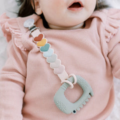 Loulou Lollipop beadless silicone pacifier clip on baby clothing for easy access