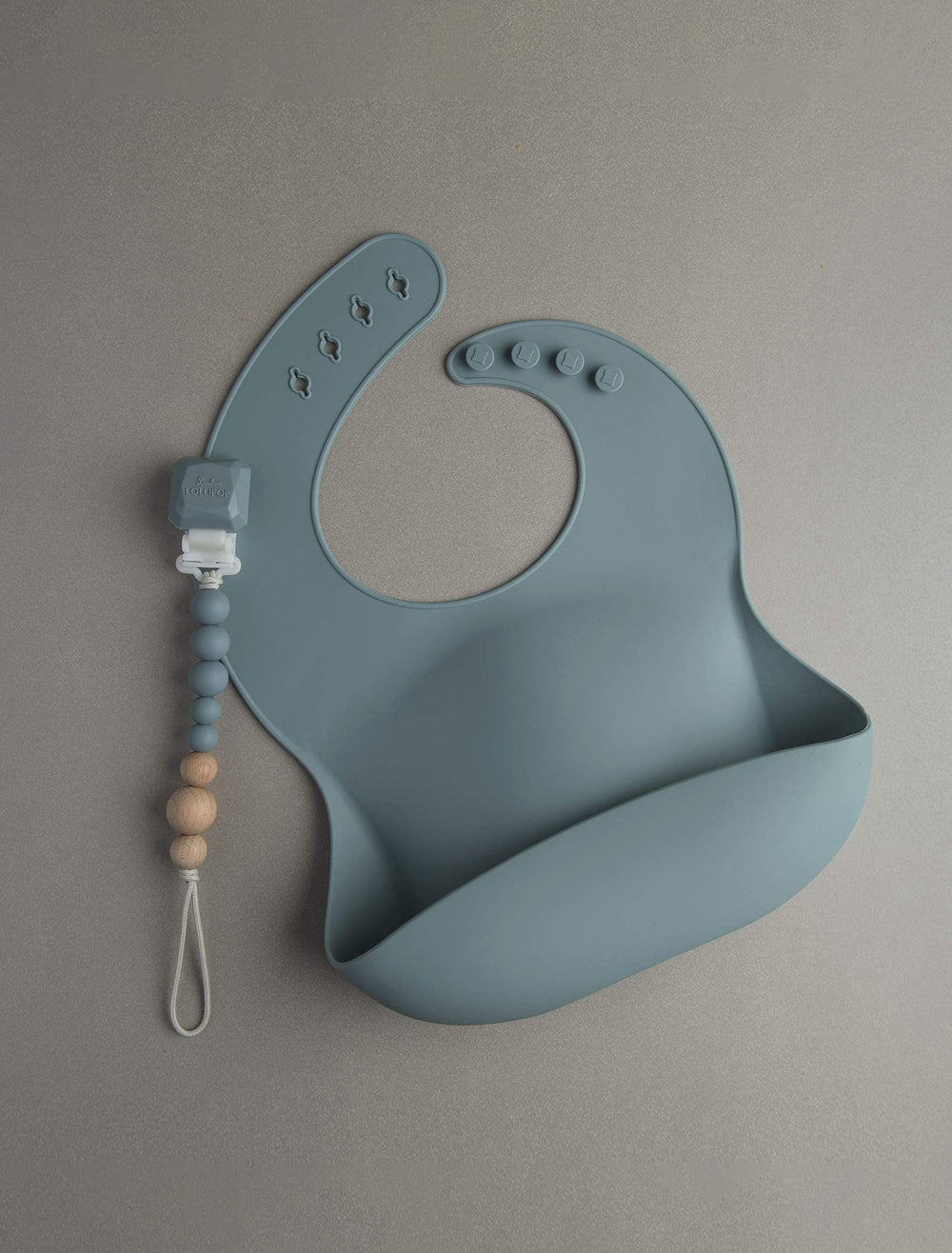 Loulou Lollipop slate bib coordinating with pacifier clips