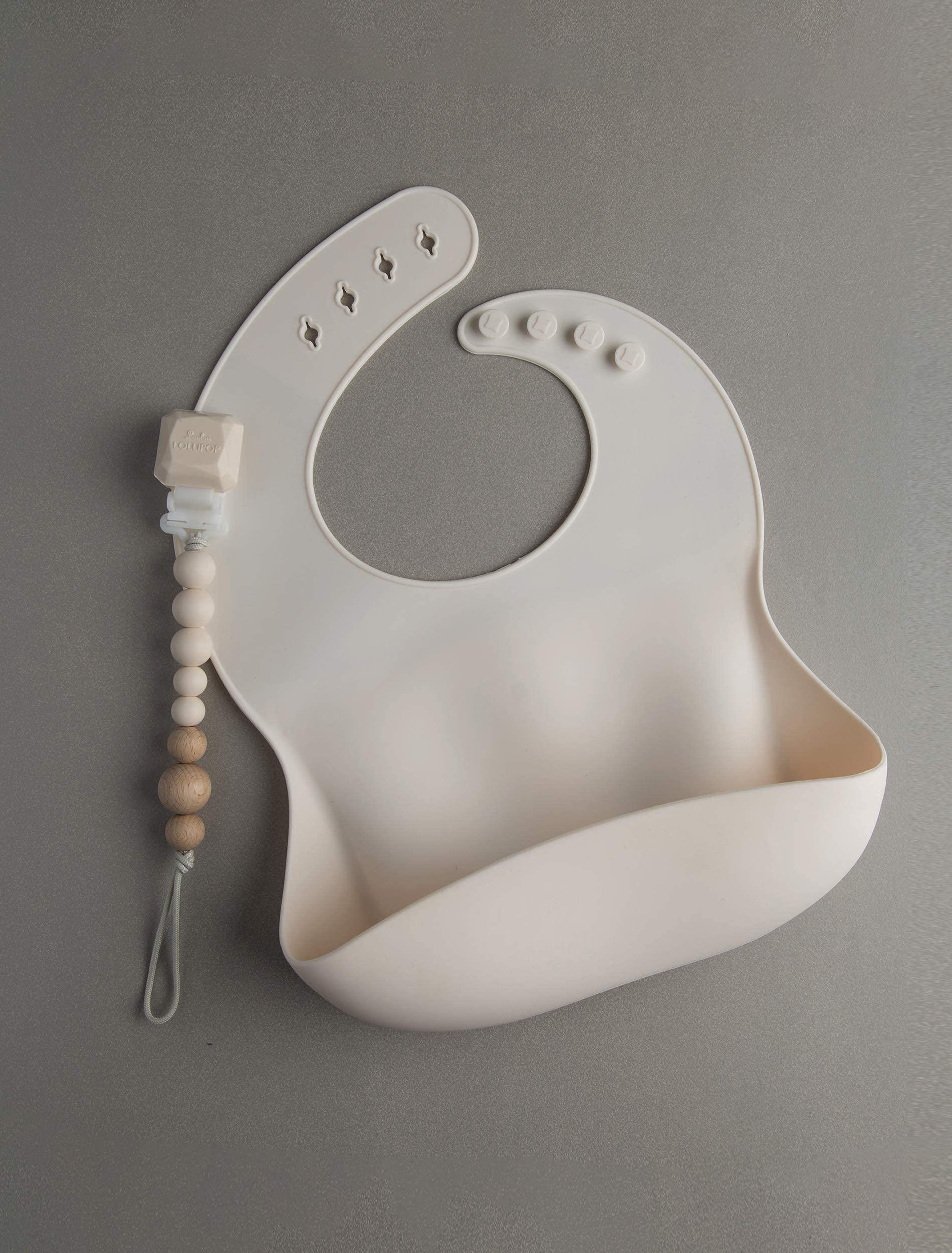 Loulou Lollipop coconut cream baby bib prepared for meals.