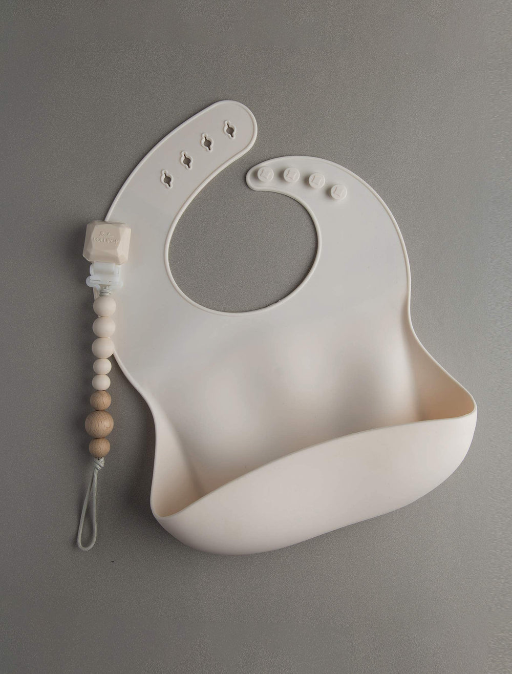 Loulou Lollipop coconut cream baby bib prepared for meals.