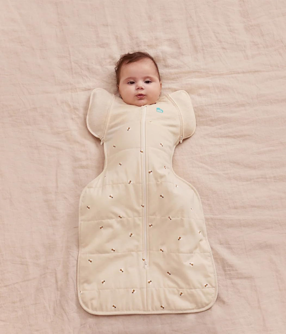 Love To Dream Swaddle Up Transition Bag shows one arm free for momentary play and self-soothing.
