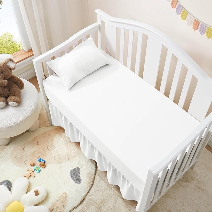 Love2Sleep crib skirt with four split corners for easy placement around posts