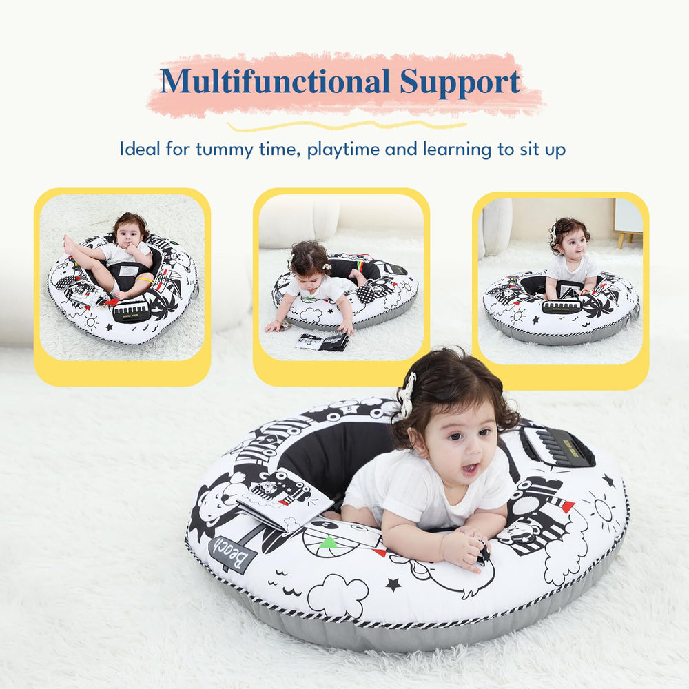 Infant seated and playing with Lovvie & Joy activity center.