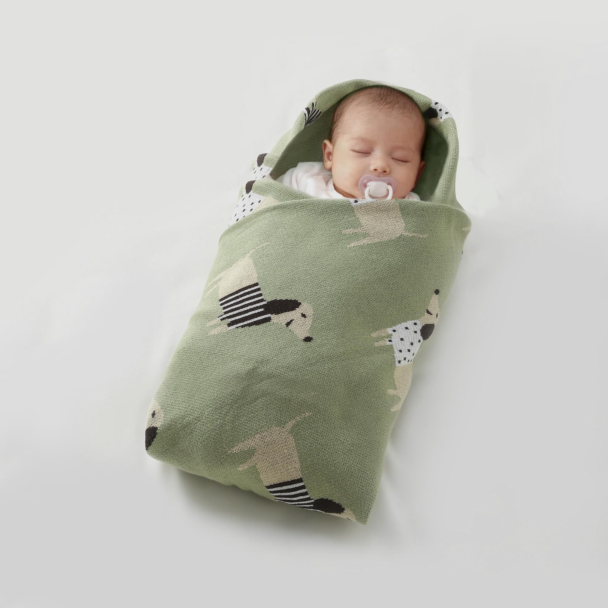Loyfoky baby blanket in knit fabric with gentle stretch for movement.