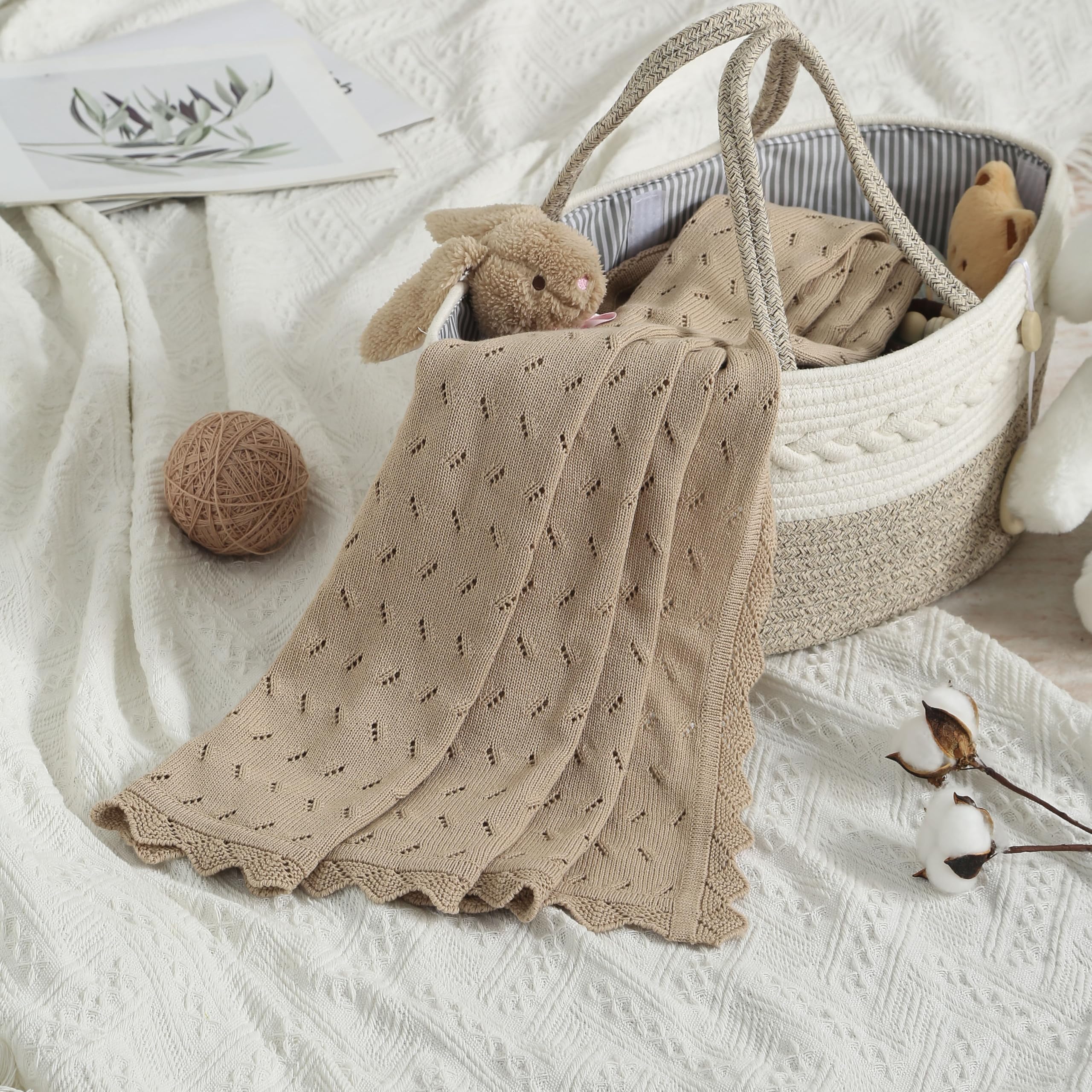 Loyfoky blanket being used for swaddling a newborn.