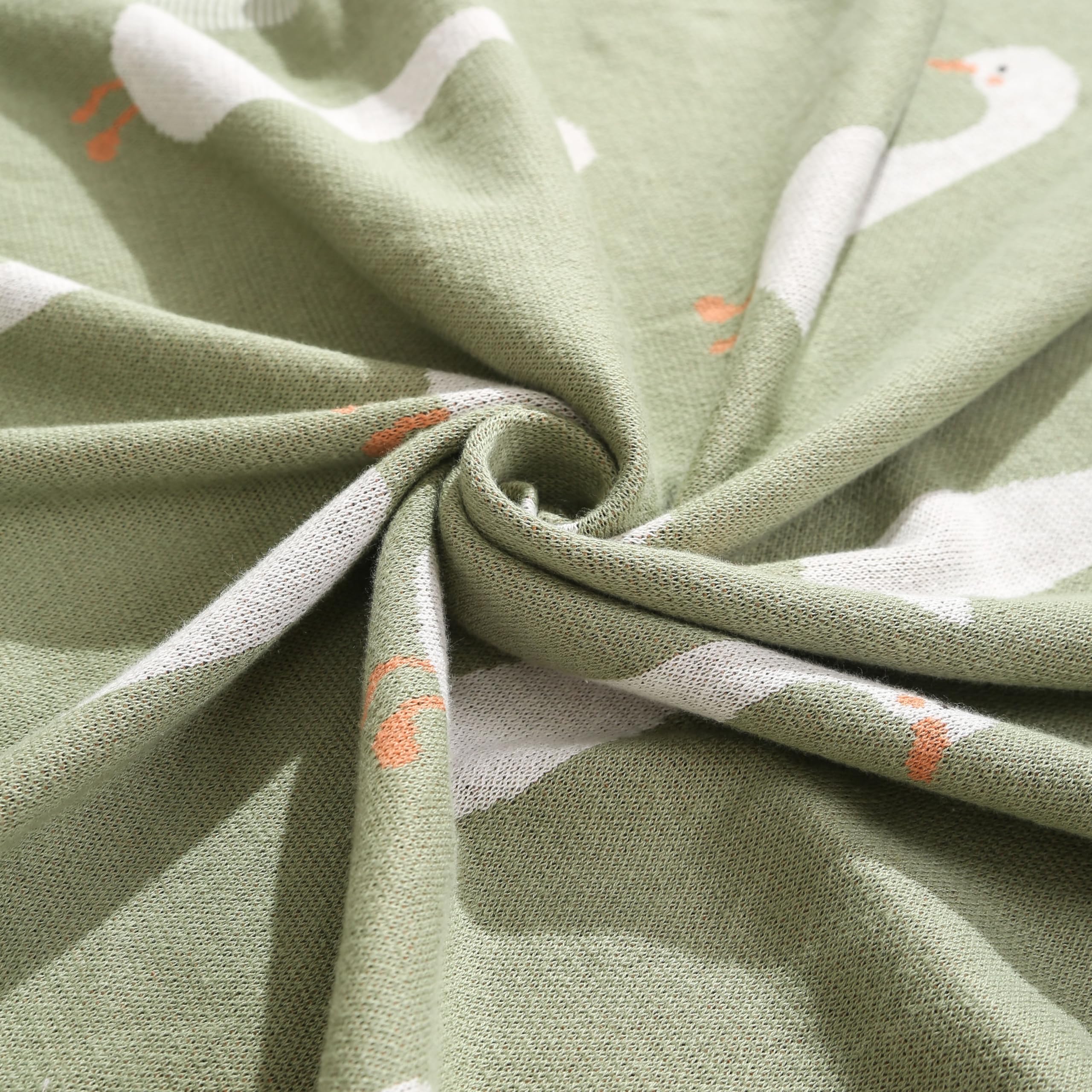 Loyfoky green goose blanket adds color and comfort to the nursery.
