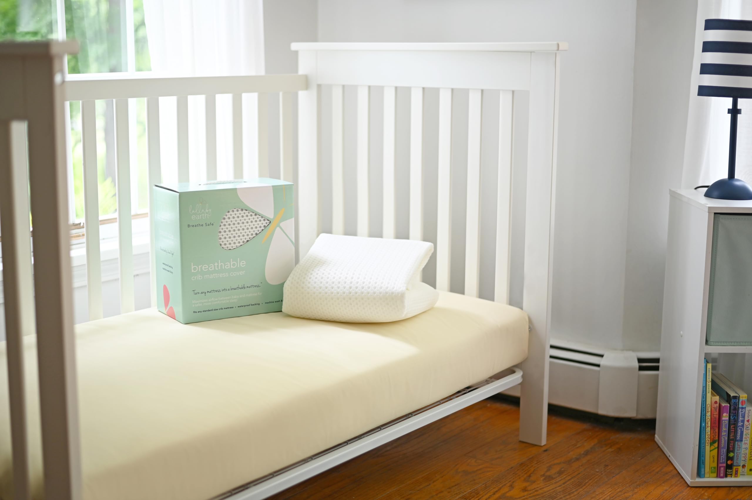 Baby nap with Lullaby Earth pad showing breathable sleep surface