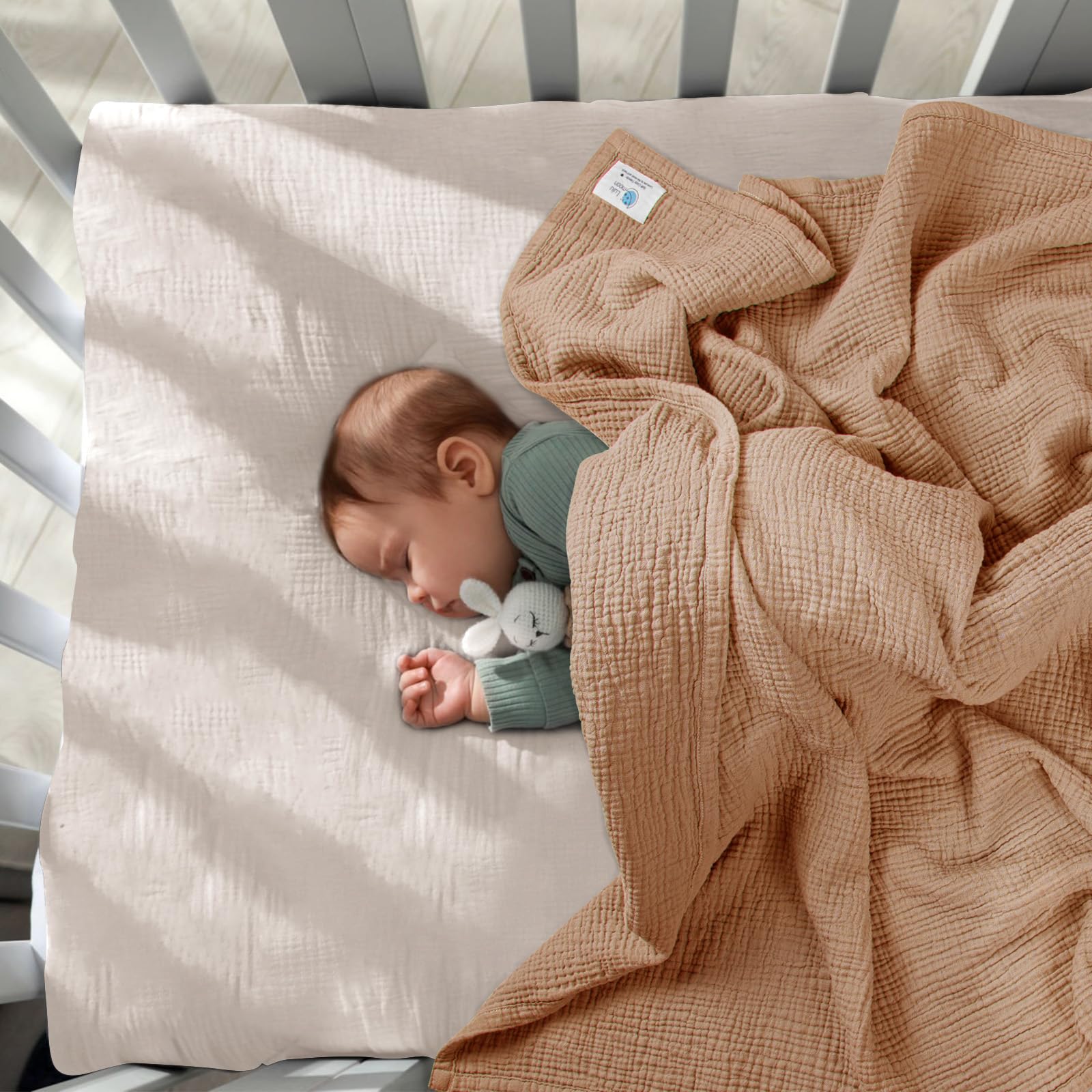 Lulu Moon muslin baby blanket used during naptime snuggling.