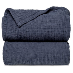 Lulu Moon muslin blanket blue folded for easy storage and warmth