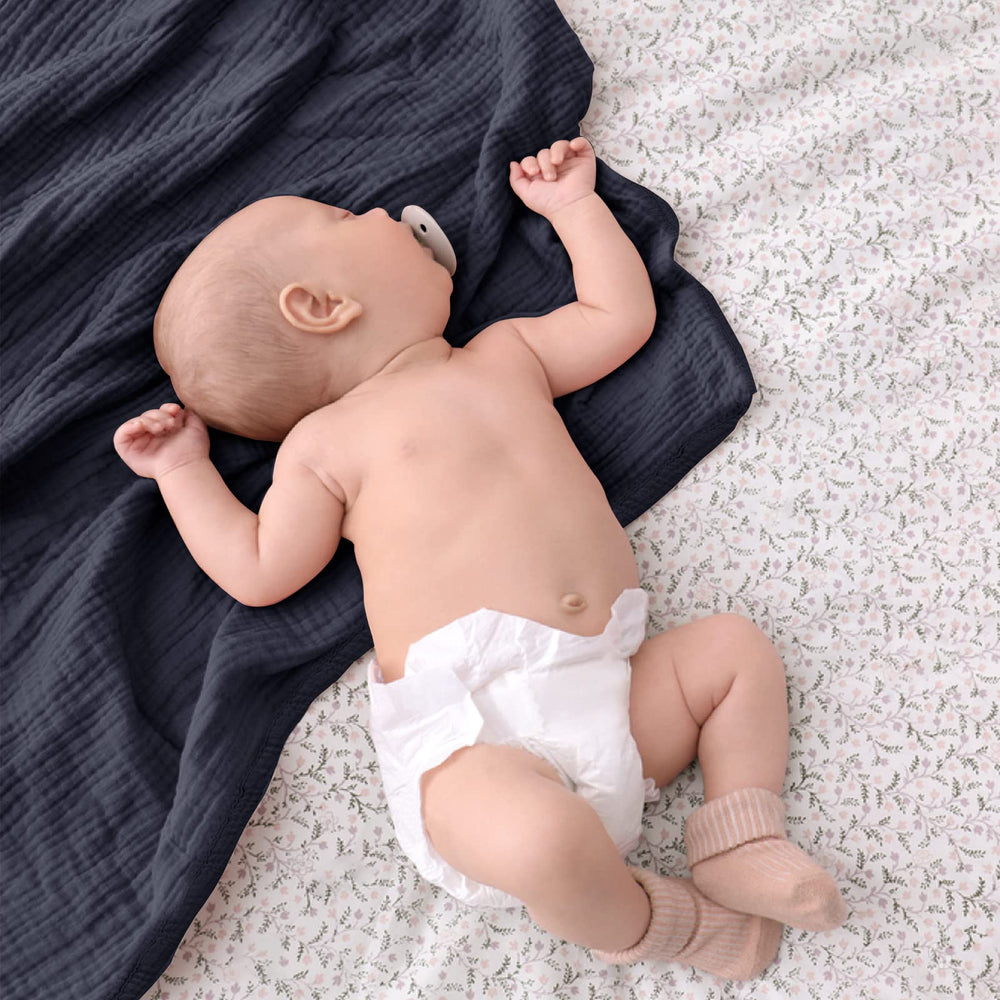 Lulu Moon muslin blanket blue in stroller or car seat for travel comfort