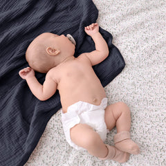 Lulu Moon muslin blanket blue in stroller or car seat for travel comfort