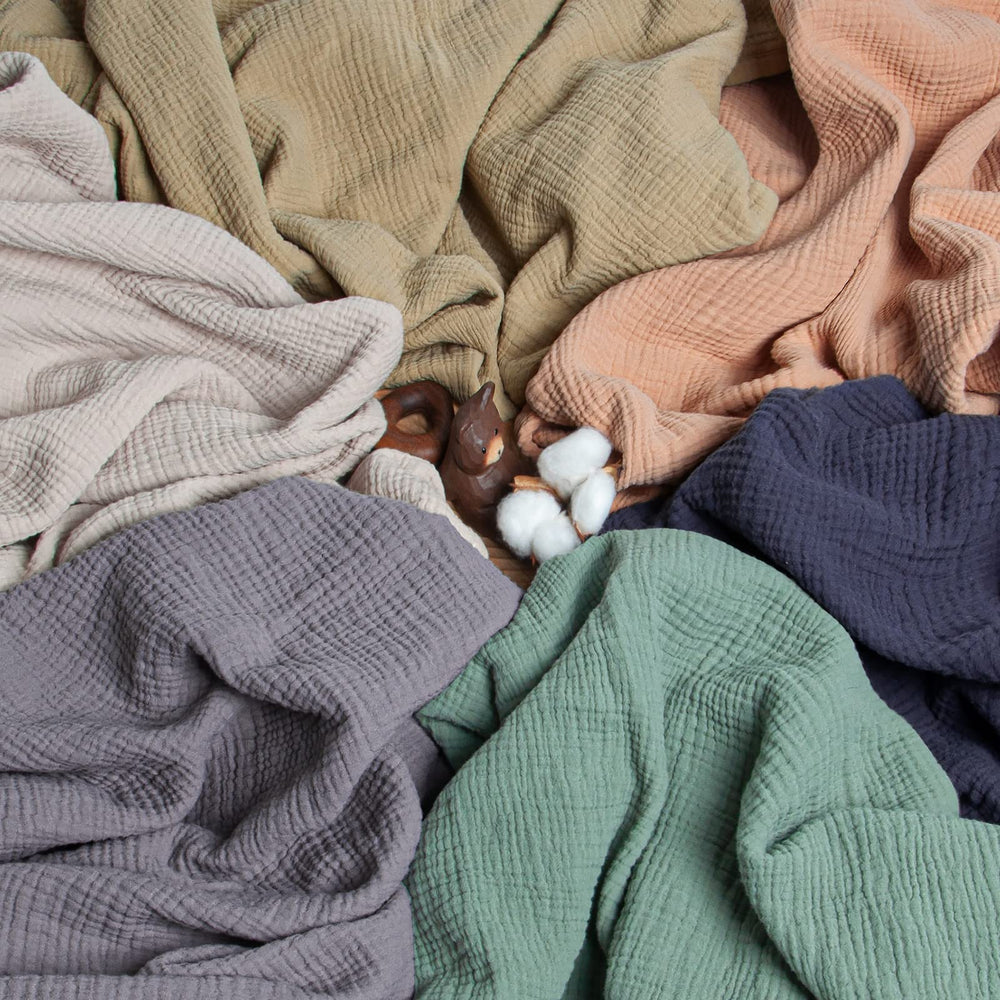 Lulu Moon muslin blanket close-up weave, soft airy layers for year-round comfort