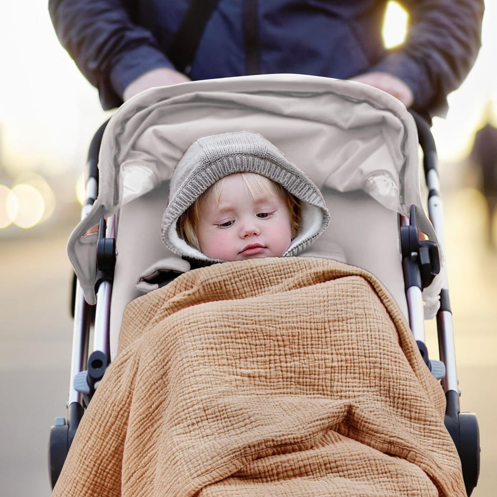 Lulu Moon muslin blanket in stroller or car seat for comfortable coverage.