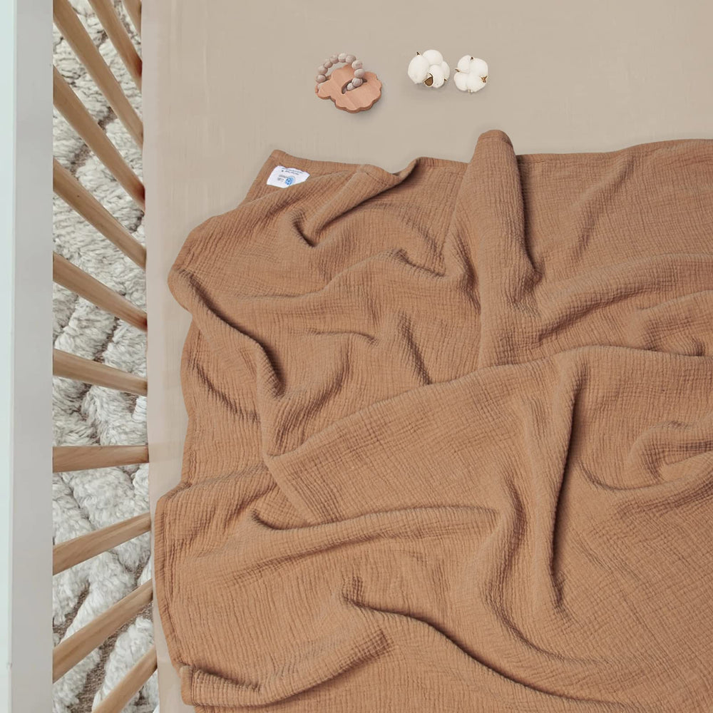 Lulu Moon four-layer gauze blanket emphasizes breathable all-season comfort.