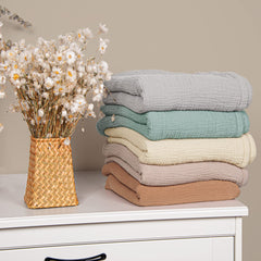 Lulu Moon muslin texture close-up highlighting soft weave and breathability.