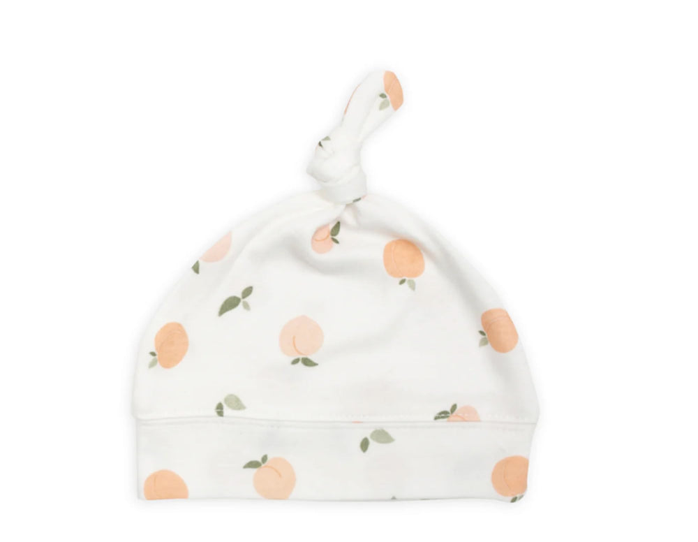 Lulujo adjustable-bamboo-jersey-hat demonstrates easy fit for newborns and photo moments.
