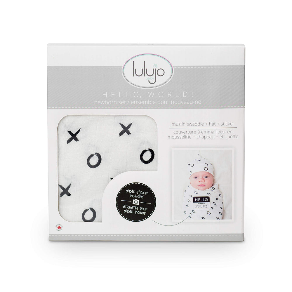 Lulujo adjustable top knot hat demonstrates customizable newborn fit