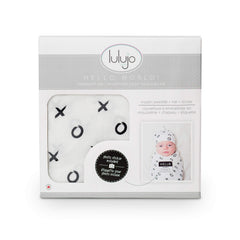 Lulujo adjustable top knot hat demonstrates customizable newborn fit