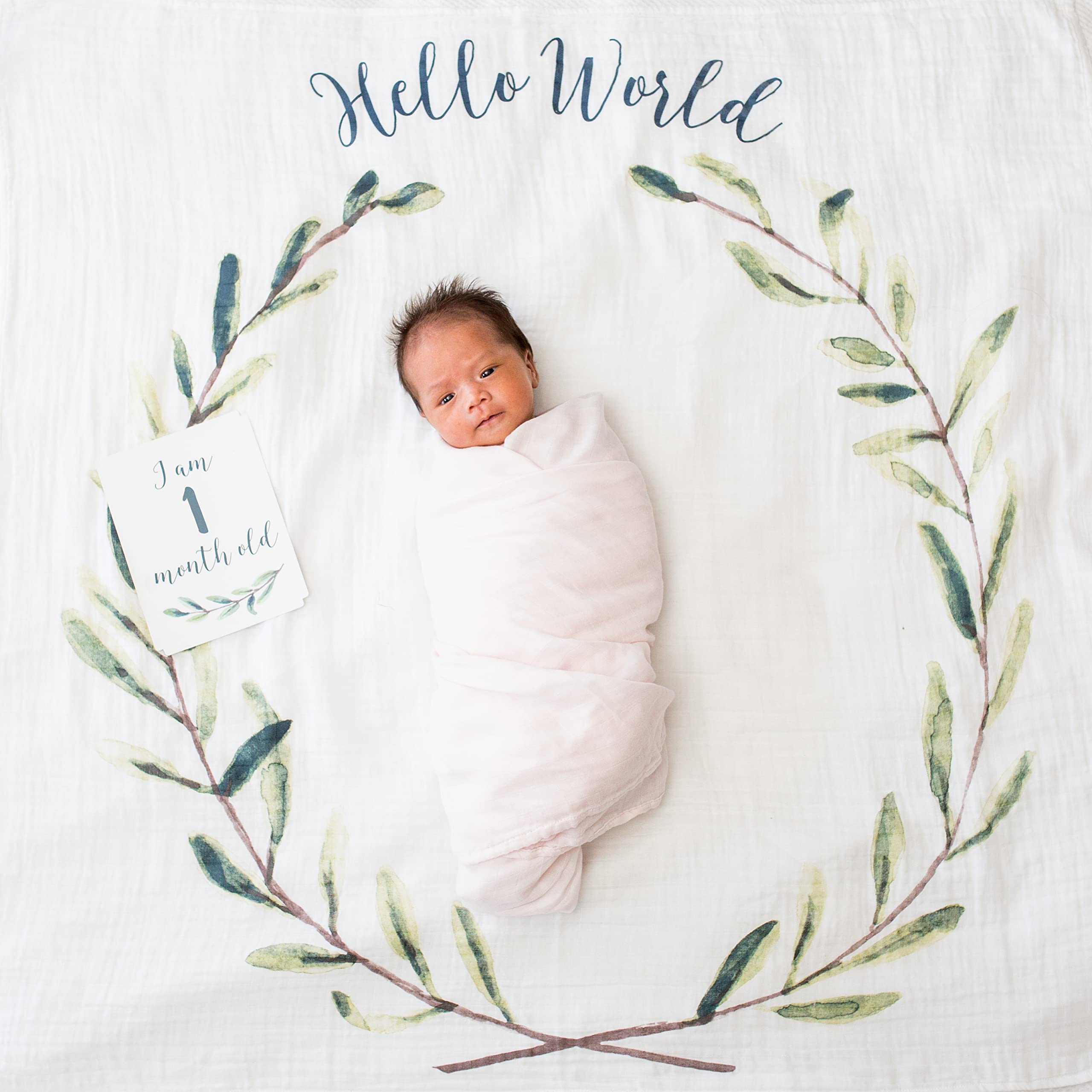 Lulujo blanket shown as swaddle or nursing cover for calm baby sessions