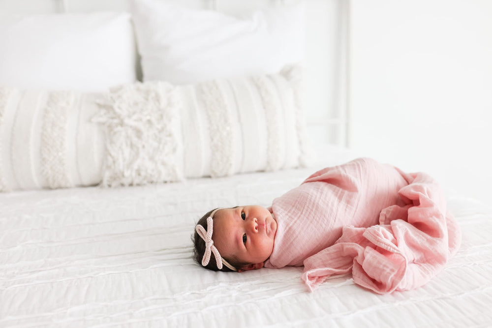 Lulujo breathable cotton muslin detail highlighting airy warmth.
