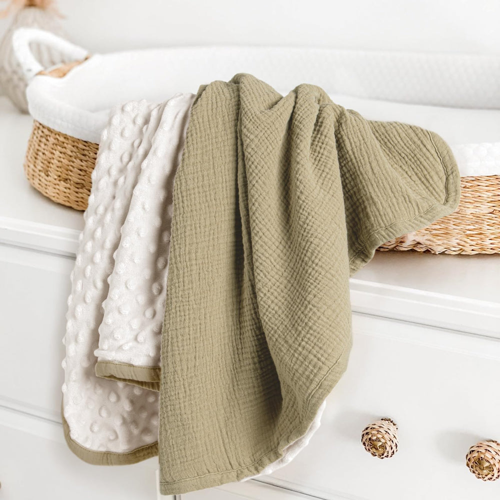 Lulumoon olive baby blanket with muslin front delivers breathable comfort for naps.