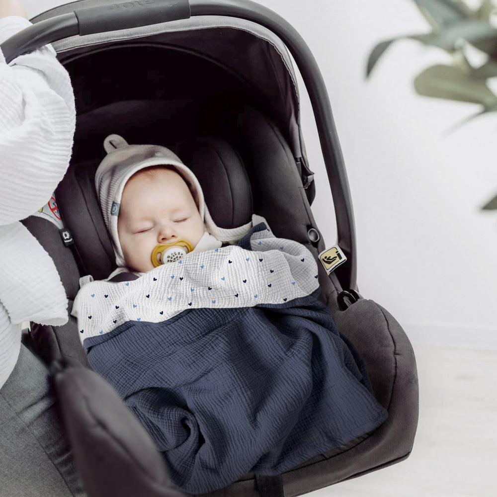Lulumoon blanket used as stroller sun-shield during outings.