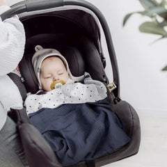 Lulumoon blanket used as stroller sun-shield during outings.