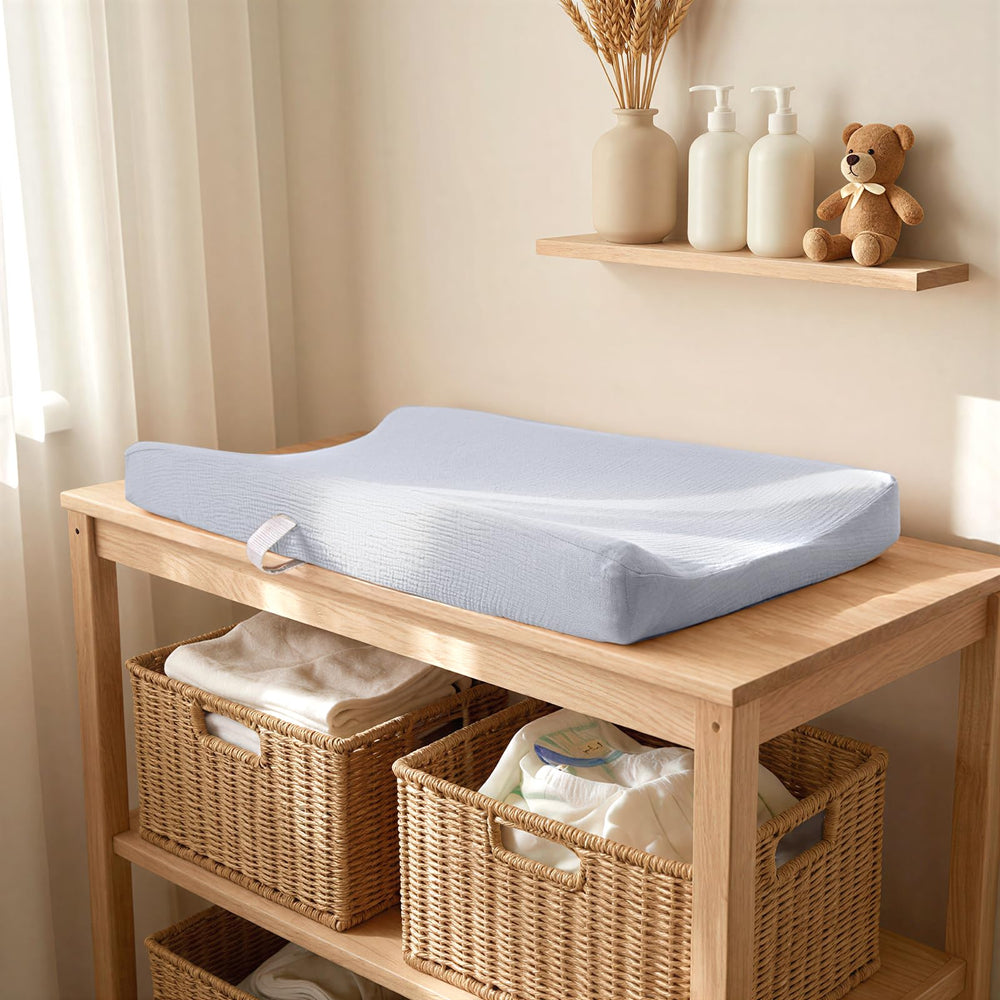 Lulumoon buckle-strap holes add security on changing tables