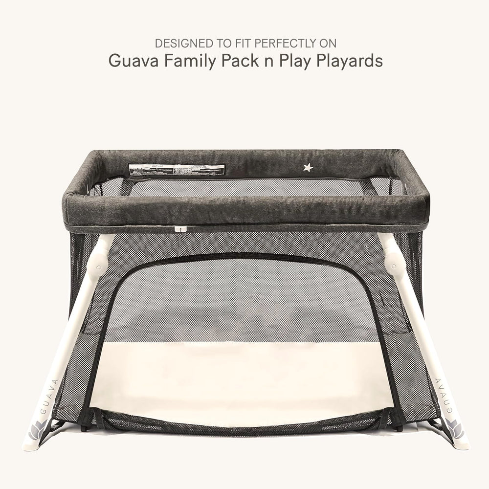 Lulumoon fitted sheet snug edge demonstrates secure fit for Guava Family playard.