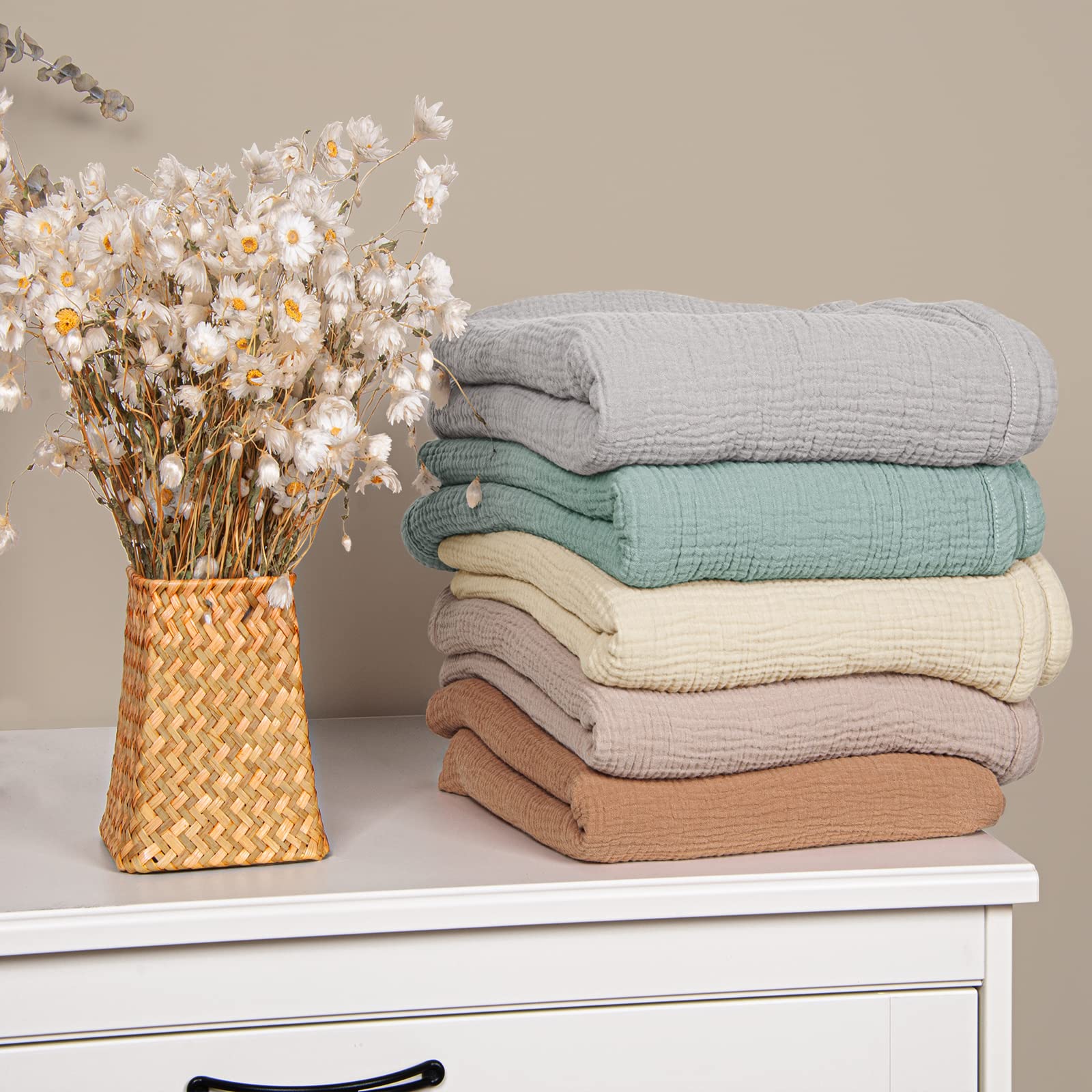 Lulumoon sage muslin baby blanket ready for nap-time swaddle.