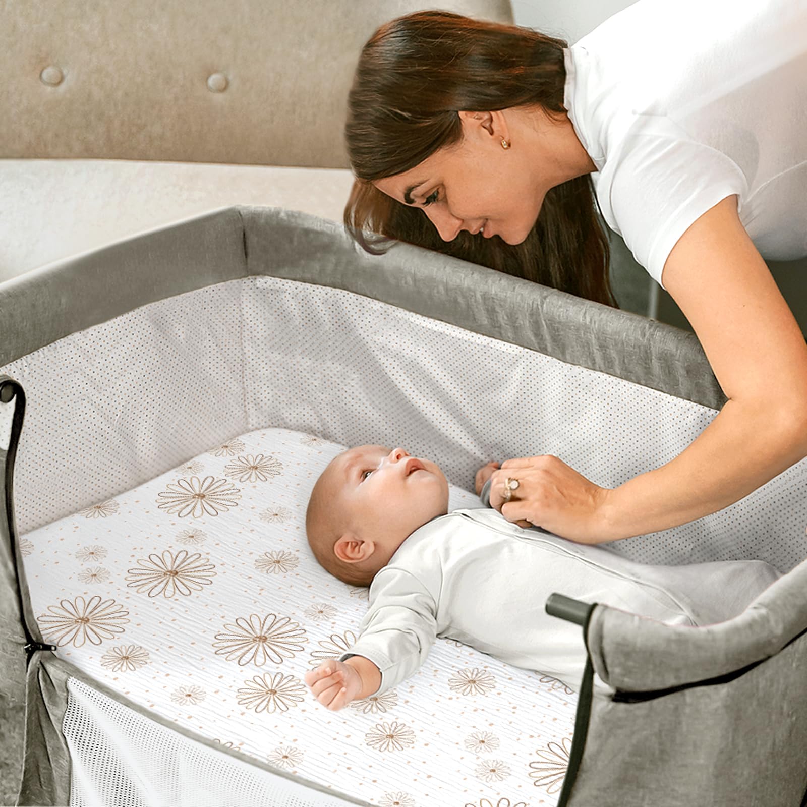 Lulumoon deep pocket muslin sheet hugging the 4 inch bassinet mattress for stability
