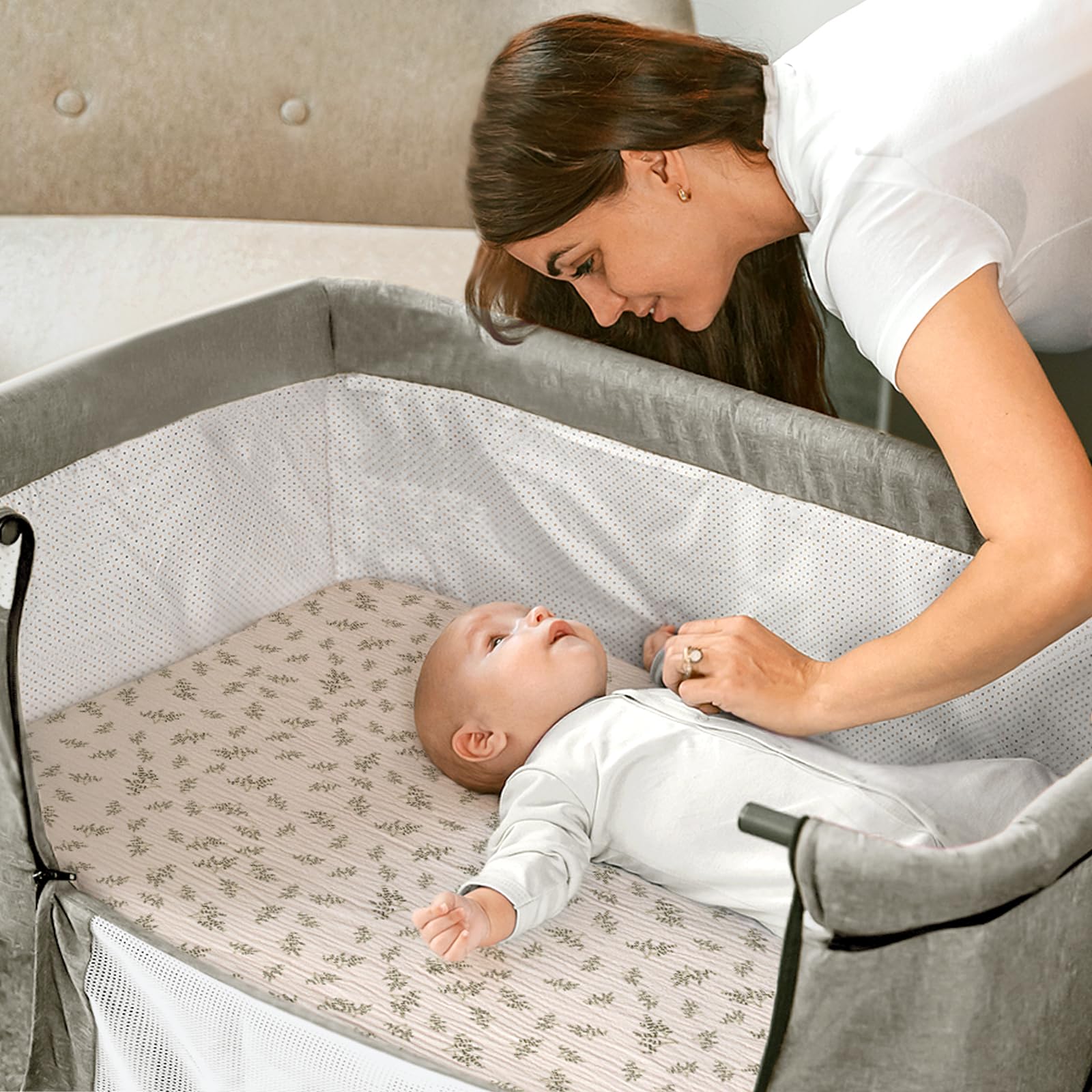 Bassinet sheet with elastic edges provides a secure, snug fit.