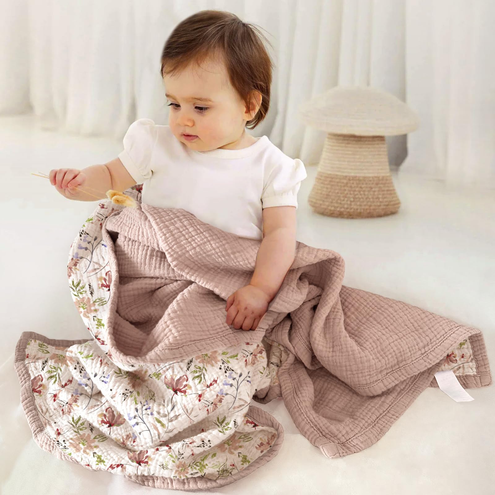 Lulumoon muslin blanket sand floral back view, breathable comfort on warm days.