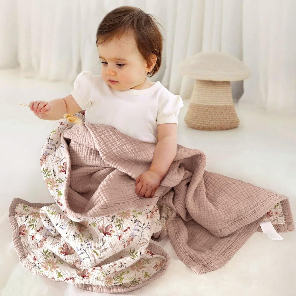 Lulumoon muslin blanket sand floral back view, breathable comfort on warm days.