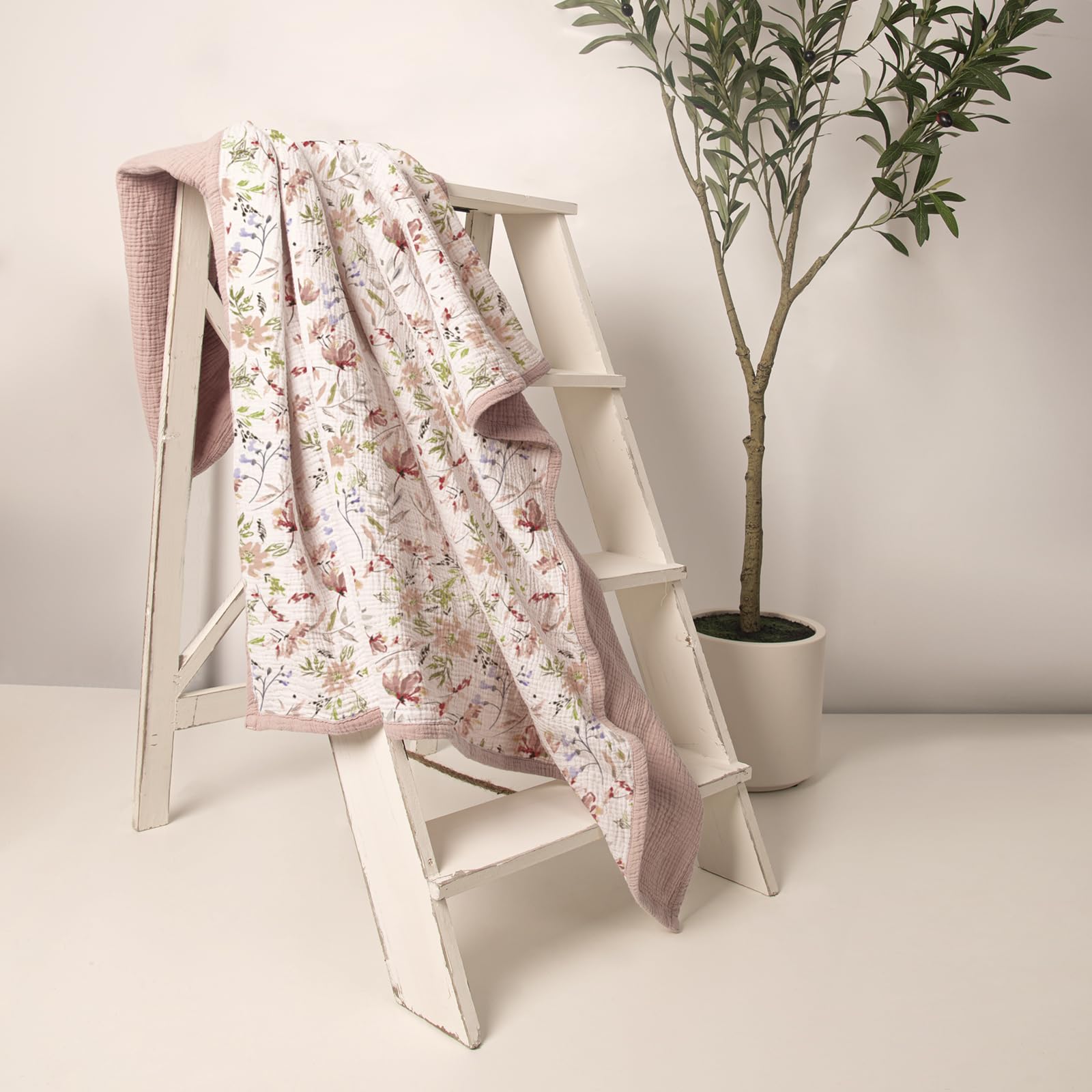 Lulumoon muslin blanket folded layers detail, four-layer design showcased.