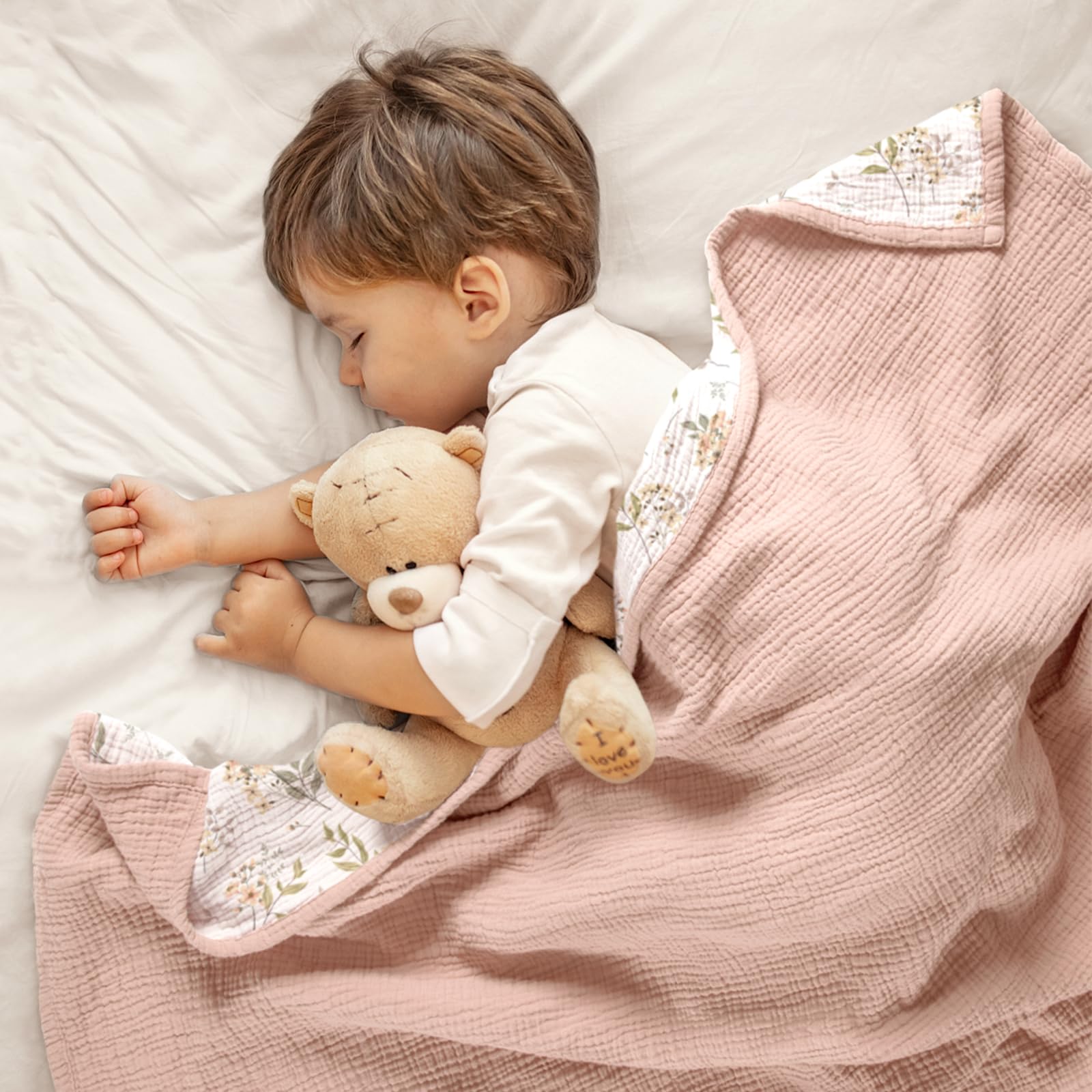 Lulumoon Muslin Blanket pink floral design during nap-time play.