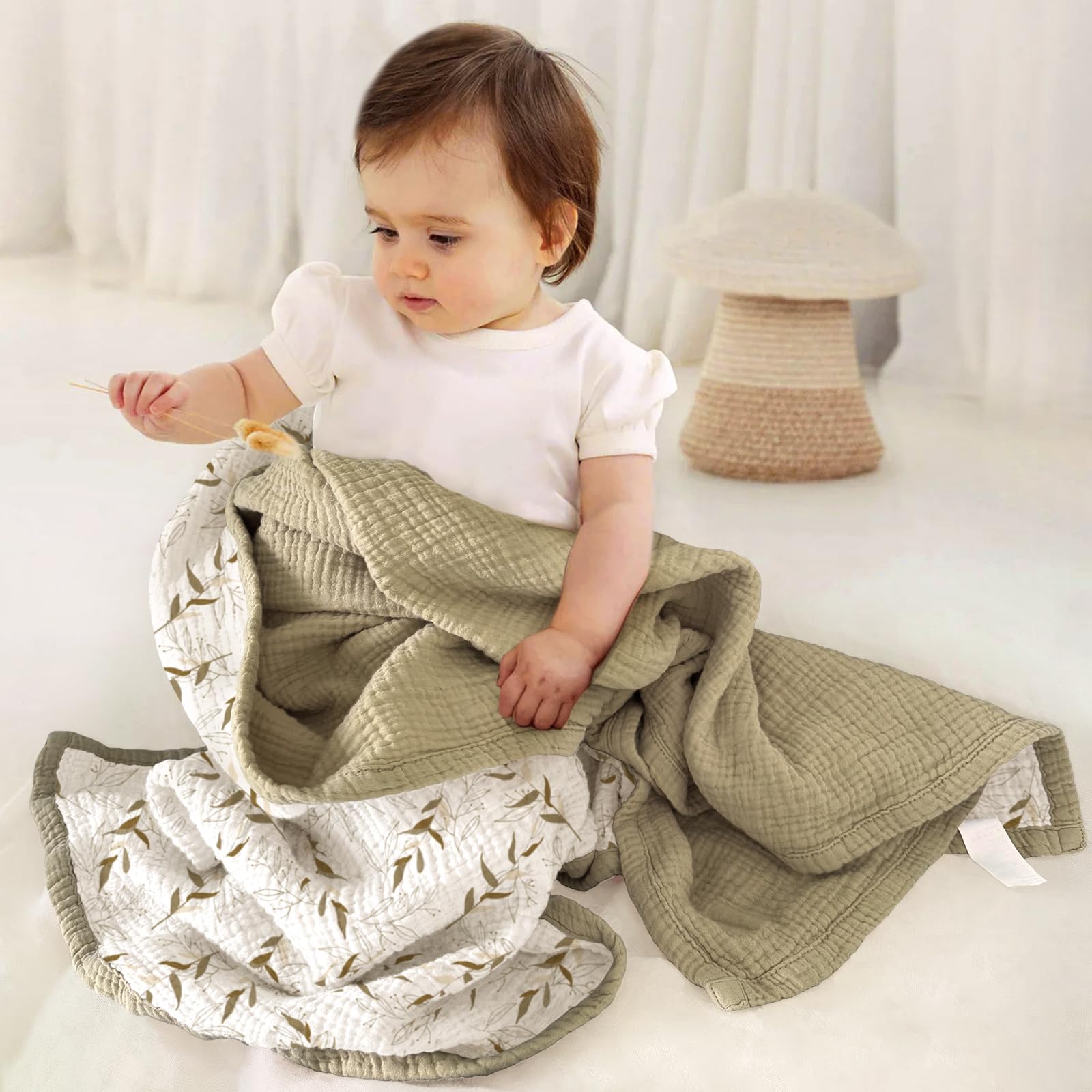 Lulumoon muslin baby blanket in nursery showing soft touch and breathability