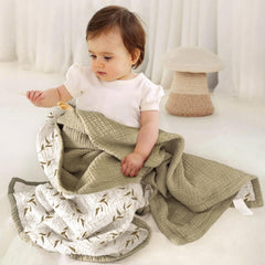 Lulumoon muslin baby blanket in nursery showing soft touch and breathability