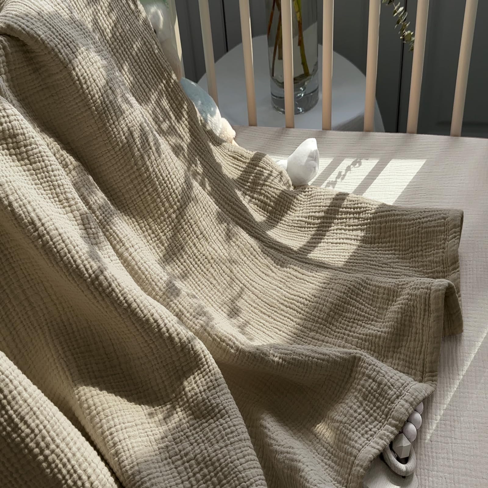 Lulumoon olive muslin blanket in car seat on the go