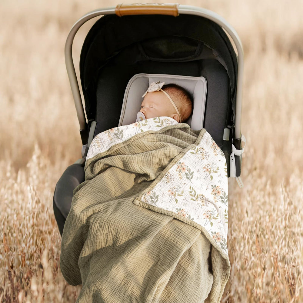 Lulumoon Muslin Blanket Olive Flower stroller shade during sunny outings