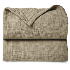 Lulumoon olive muslin blanket folded for gentle skin contact