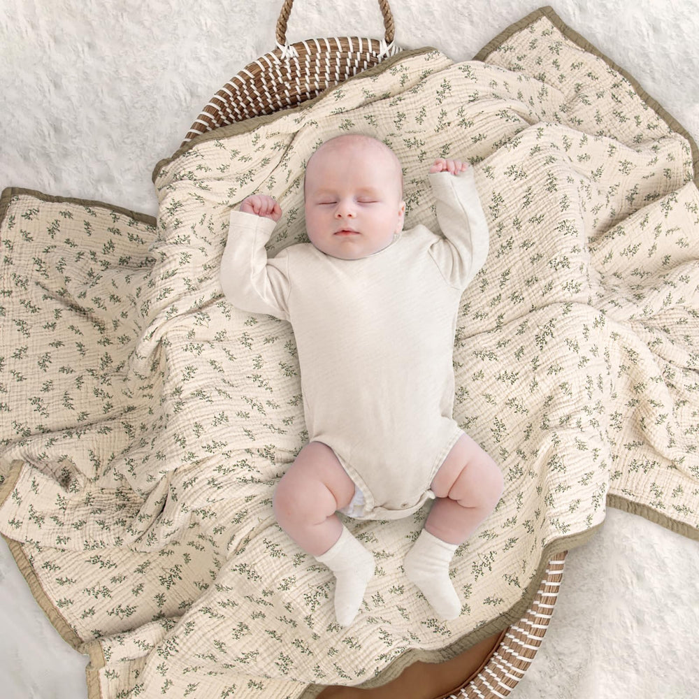 Lulumoon muslin blanket Olive Tree backdrop supports photography sessions and baby playtime.