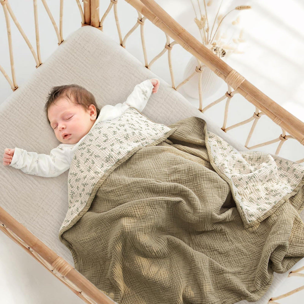 Lulumoon muslin blanket Olive Tree weave highlights breathable four-layer design for gentle warmth.