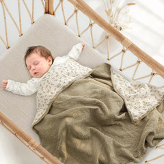 Lulumoon muslin blanket Olive Tree weave highlights breathable four-layer design for gentle warmth.