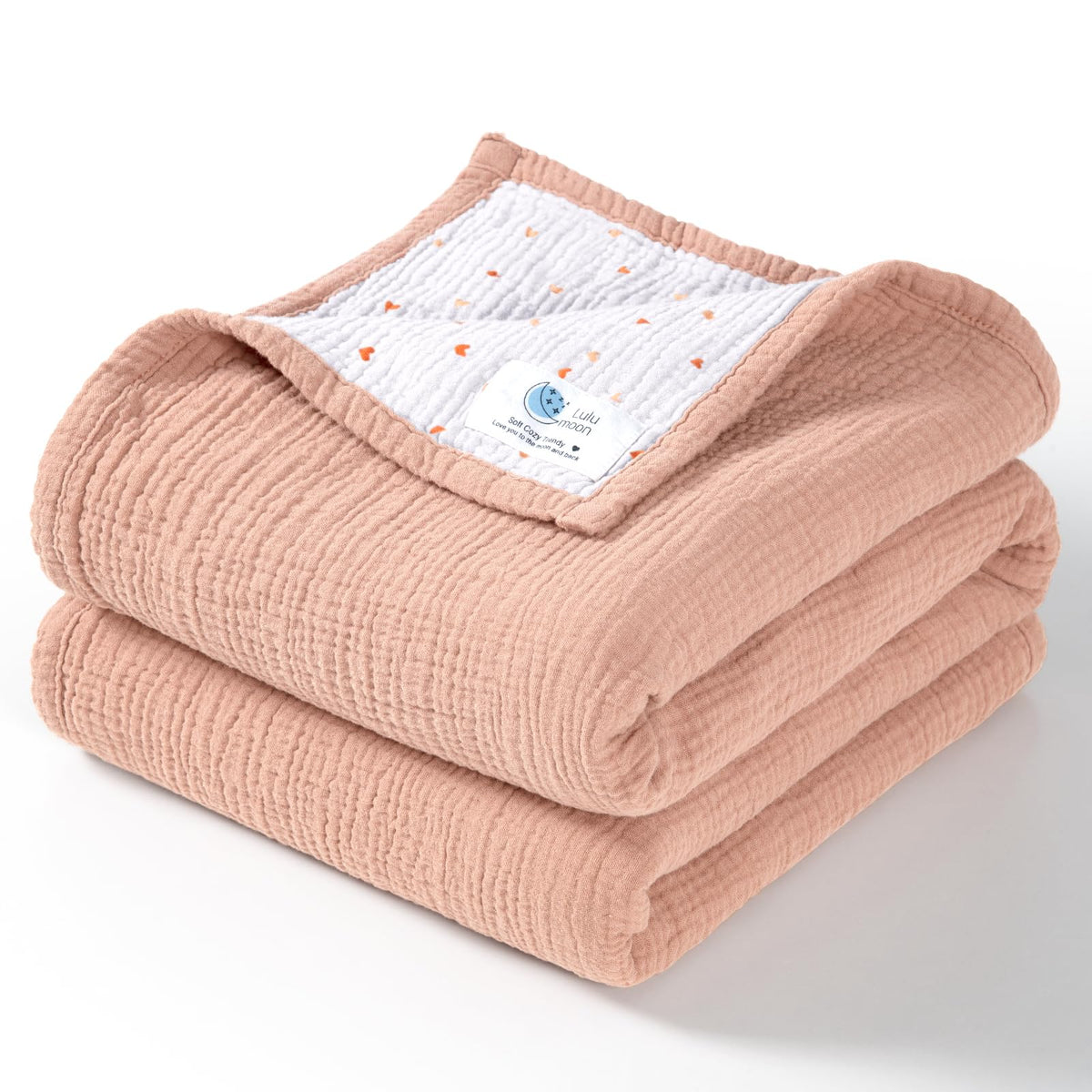 Lulumoon muslin blanket peach pink folded for cozy warmth.