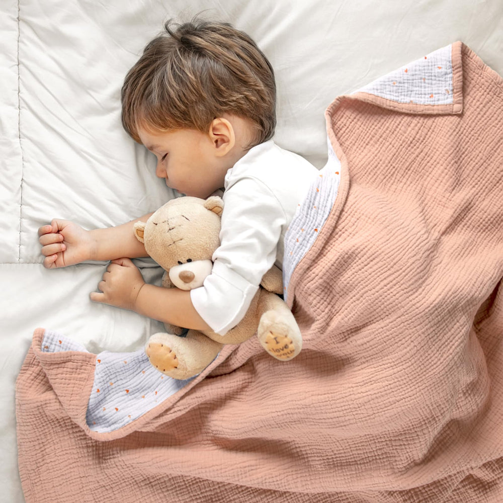 Lulumoon muslin blanket peach pink reversible design offers two looks.