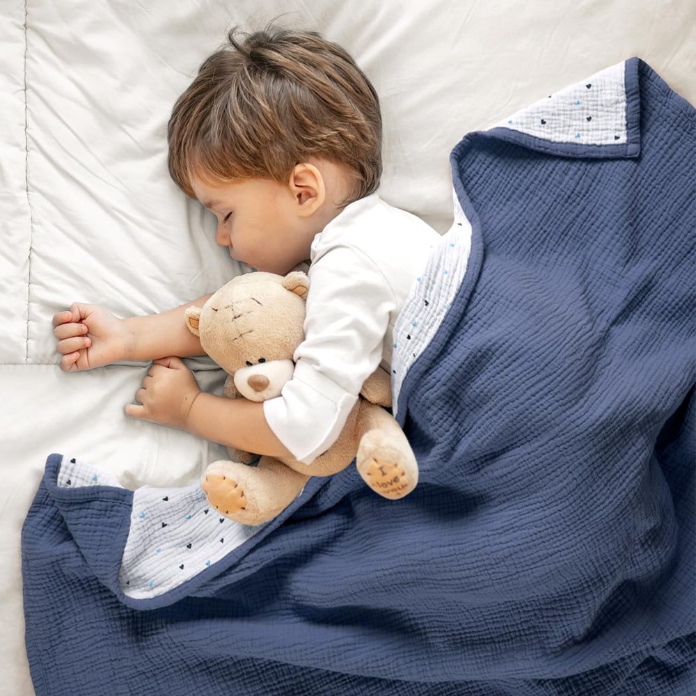 Lulumoon muslin blanket attached to stroller as sun shield for outdoor trips