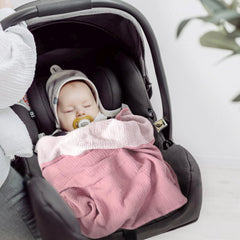 Lulumoon blanket shields sun on stroller during outdoor walks.