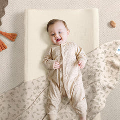 Lulumoon changing pad cover showing belt-hole design for safe changes