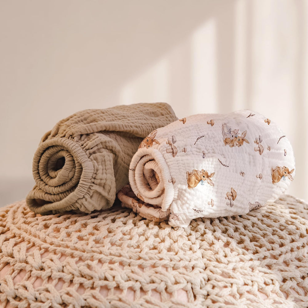 Lulumoon bunny-pattern muslin cover stays cool and gentle during diaper changes.
